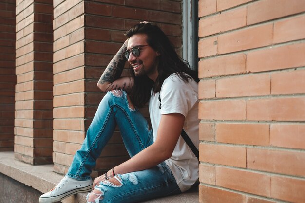 Attractive young man wearing sunglasses