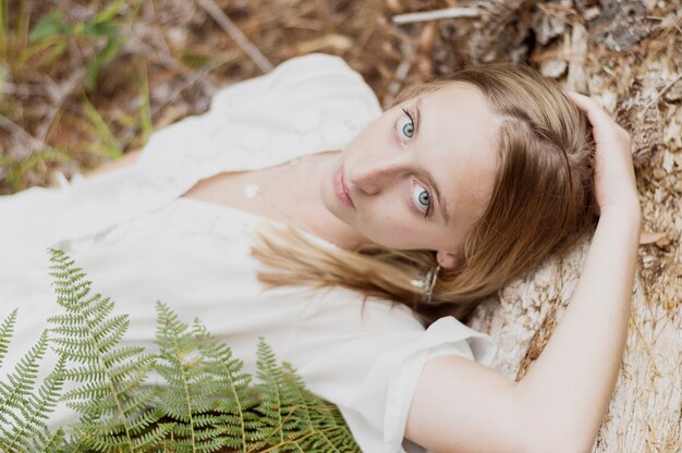 Attractive young woman lying on the ground