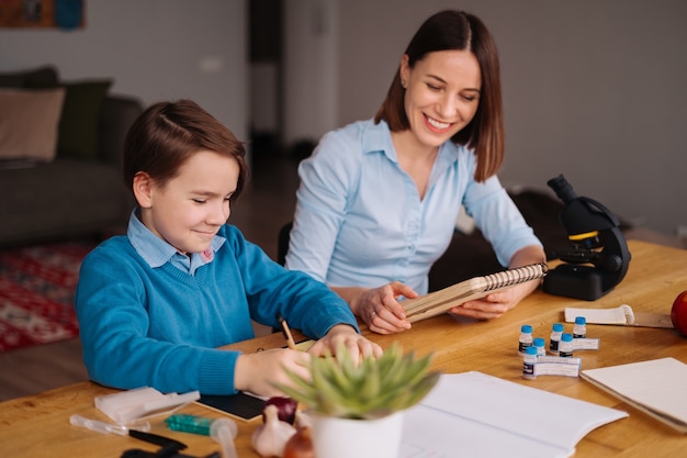 Free photo aunt and nephew do homework together