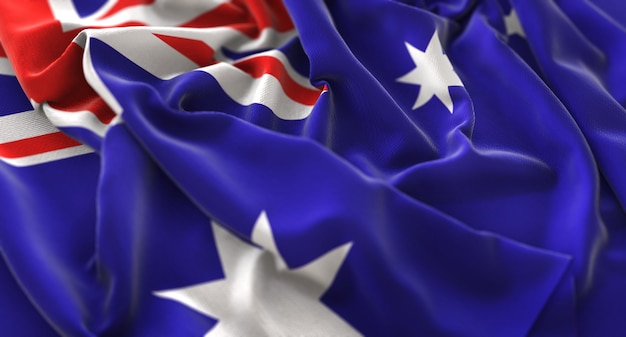 Австралийский флаг взломанный красиво размахивая макросом крупным планом