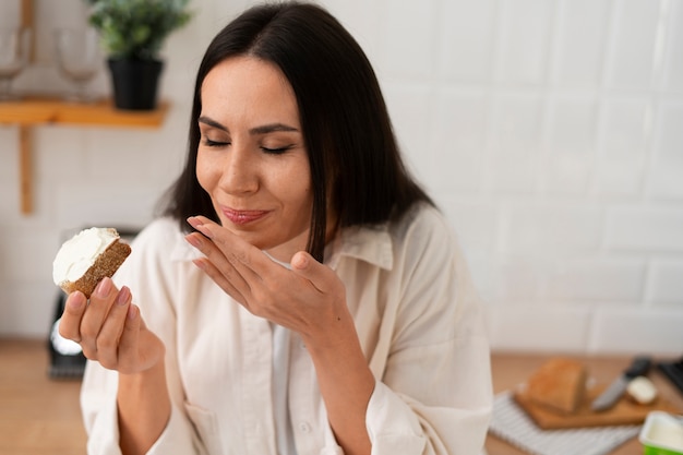 Free photo authentic person eating fresh cheese