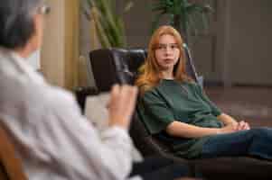 Free photo authentic scene of young person undergoing psychological therapy