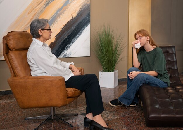 authentic scene of young person undergoing psychological therapy