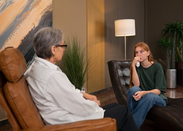 authentic scene of young person undergoing psychological therapy