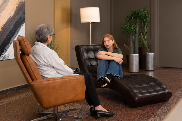 authentic scene of young person undergoing psychological therapy