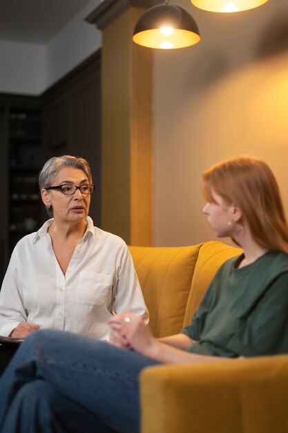 Authentic scene of young person undergoing psychological therapy