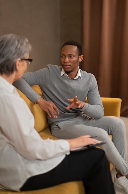 Free photo authentic scene of young person undergoing psychological therapy