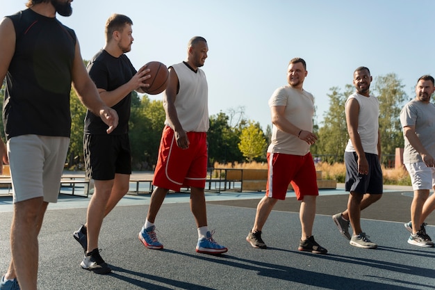 Authentic scenes of plus-size males playing basketball