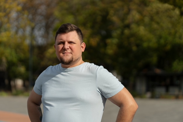 Free photo authentic scenes of plus-size males playing basketball