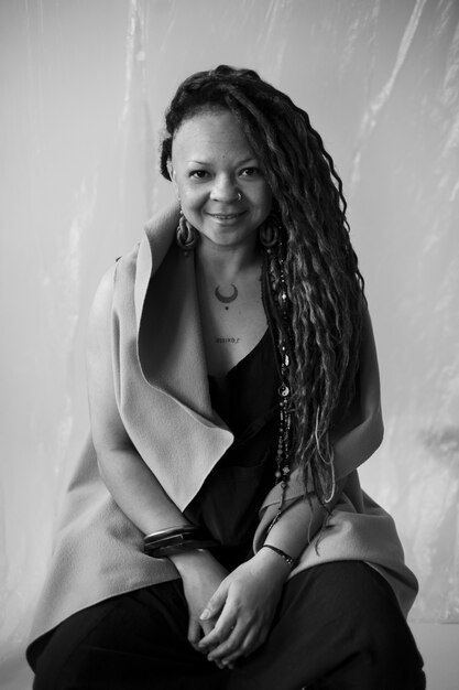 Authentic woman posing on chair medium shot