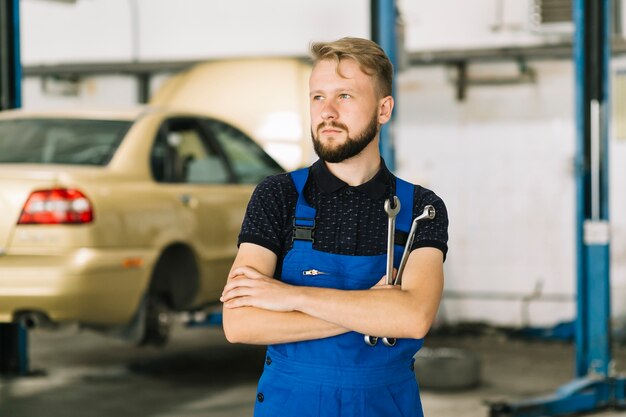 Auto mechanic in workshop