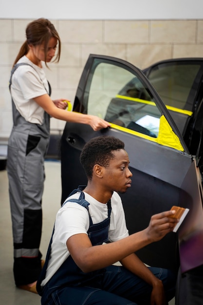 Auto service salon doign car wrapping