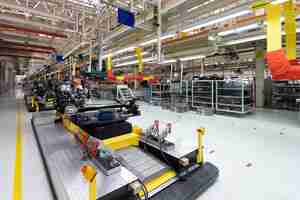 Free photo automated car assembly line plant of automotive industry shop for production and assembly of machines new car warehouse