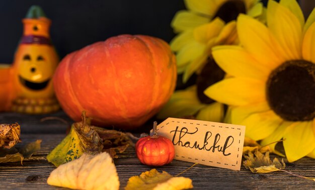 Autumn arrangement with sunflower and pumpkin