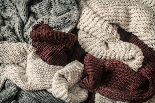 Autumn background with cozy sweaters