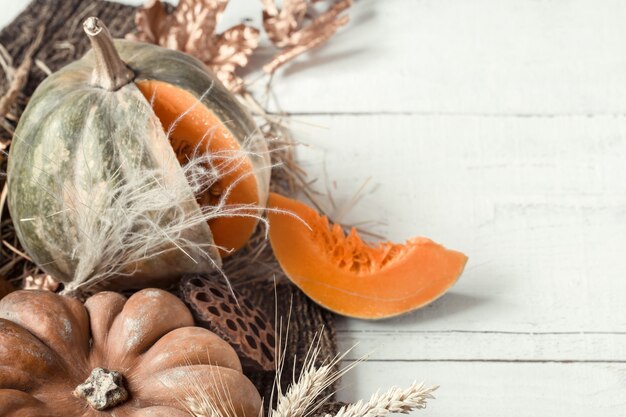 Autumn background with decorative items and pumpkin.