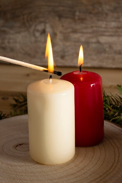 Autumn candles on wooden board