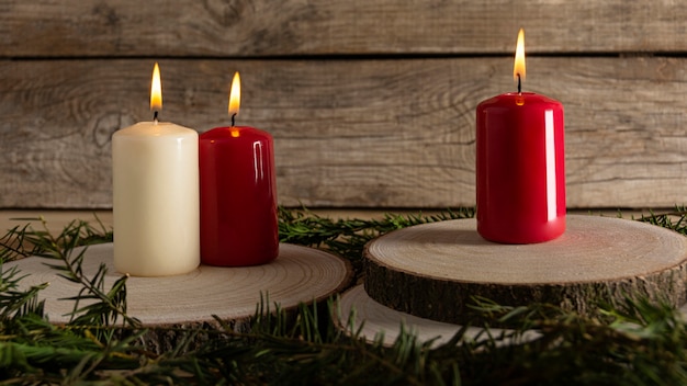 Autumn candles on wooden board