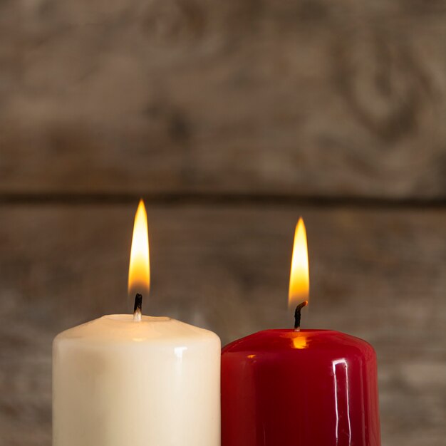 Autumn candles on wooden board