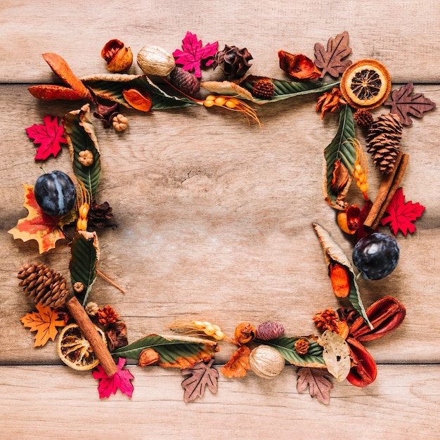 Autumn colourful frame composition on wooden background