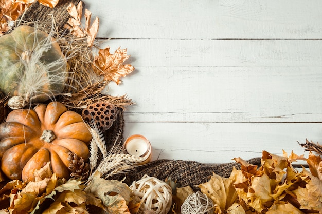 Autumn composition with decorative items and pumpkins