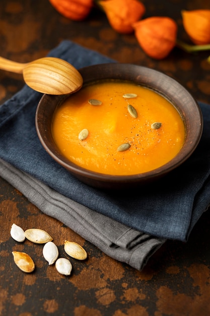 Autumn food pumpkin and mushroom soup on cloth
