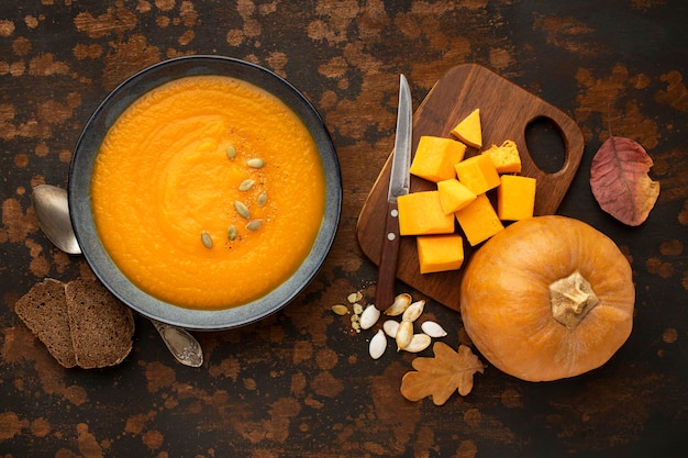 Autumn food soup pumpkin and leaves