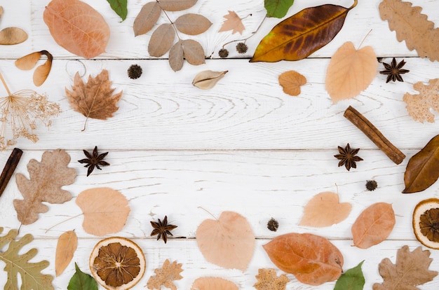 Free photo autumn leaves flat lay with copy space