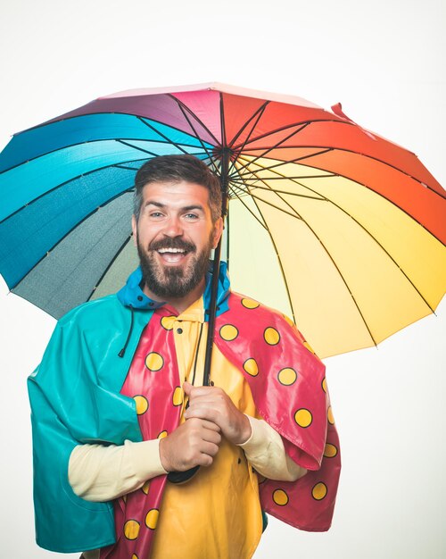Autumn mood and the weather are warm and sunny and rain is possible brutal bearded man with rainbowc...