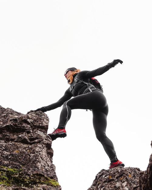 Autumn running outdoors workout jumping on the stones