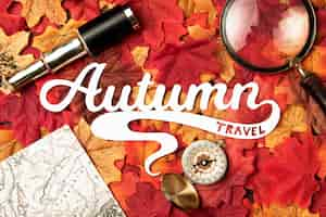 Free photo autumn travel lettering with leaves