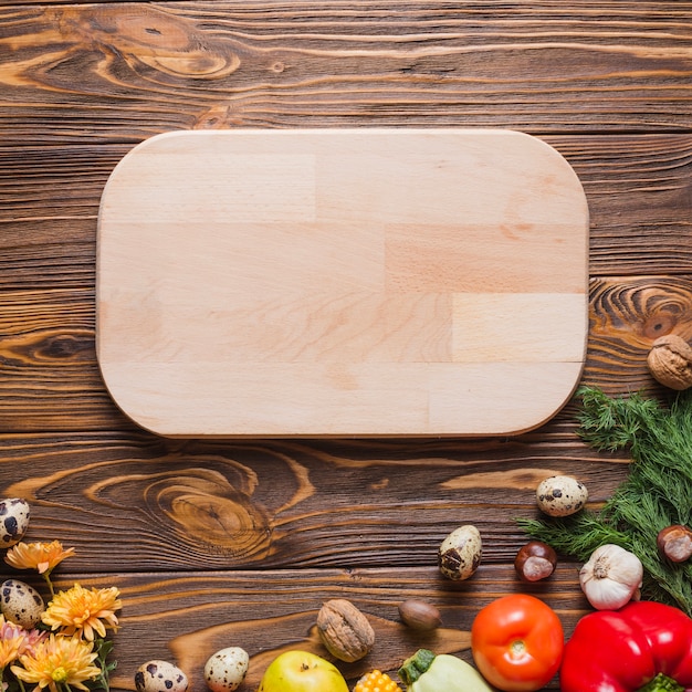 Autumn vegetables and wooden board