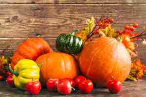 Free photo autumnal harvest against wooden wall