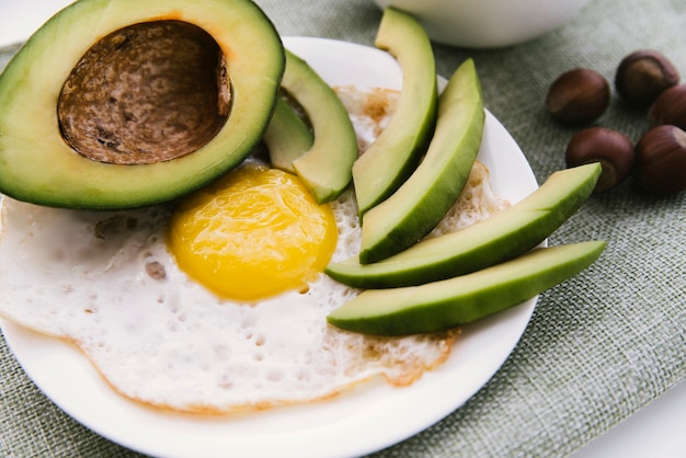 Avocado and eggs breakfast closeup 