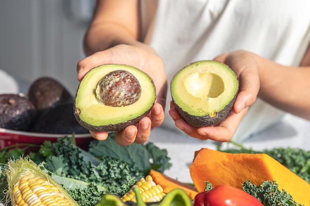 avocado-halves-female-hand-kitchen_169016-43592.jpg