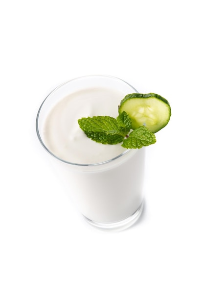 Ayran drink with mint and cucumber in glass isolated on white background