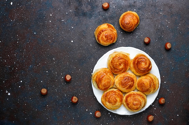 Azerbaijan national pastry qogal on white plate  ,top view,spring new year celebration novruz holiday.