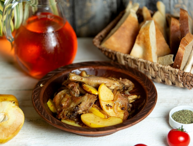 Azerbaijani chicken dish chighirtma served with potato cooked in oil