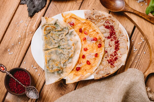 Azerbaijani gutabs platter with herbs