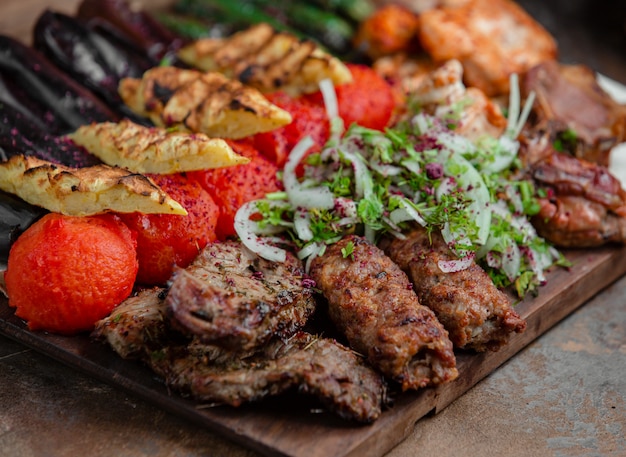 Azerbaijani lyulya kebab with potatoes and vegetables