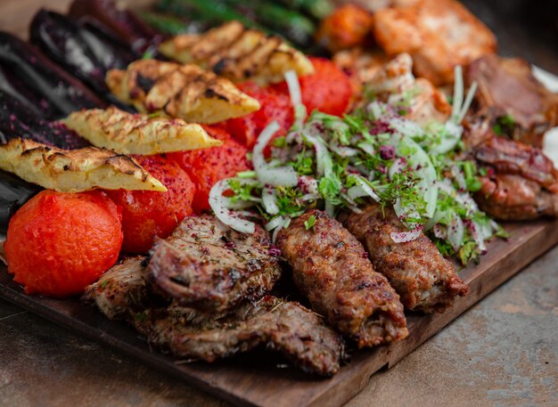 Azerbaijani lyulya kebab with potatoes and vegetables