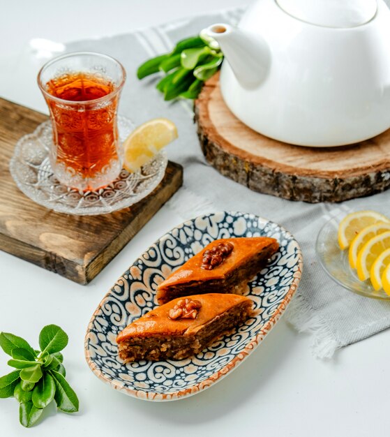 Azerbaijani traditional pakhlava with black tea on the table