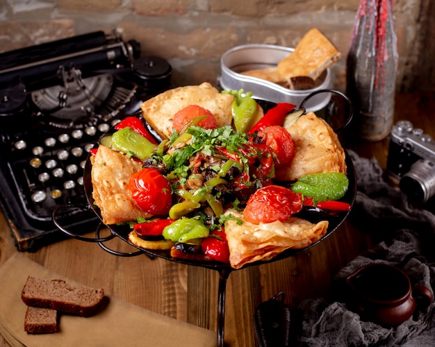 azerbaijani vegetable saj with tomato bell pepper aubergine flatbread and mushroom salad