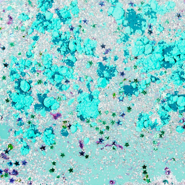 Free photo azure liquid with ornamental stars and crumbs