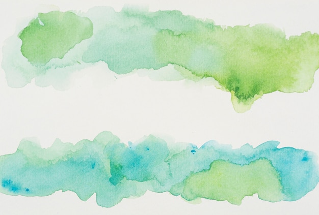 Azure and verdant paints on white paper