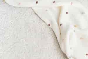 Free photo baby blanket on the floor with design space