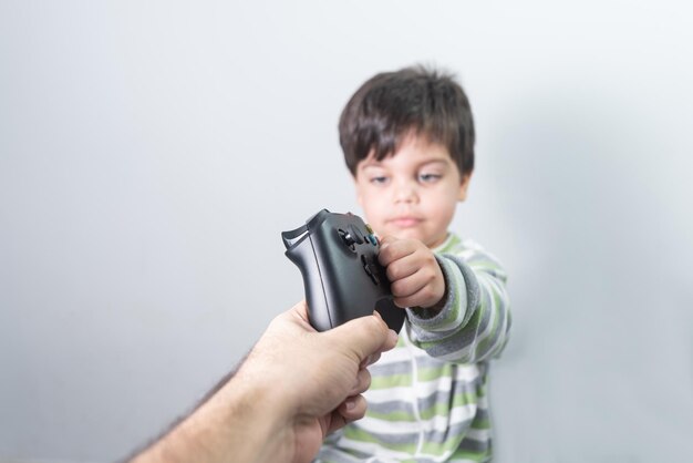 Baby boy gamer with controller in hand