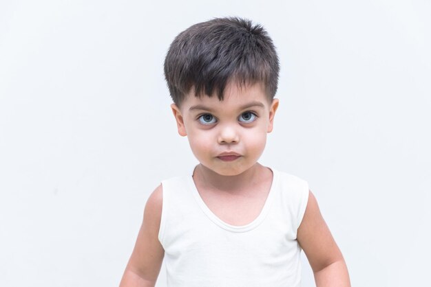 Baby boy in white tshirt over white background