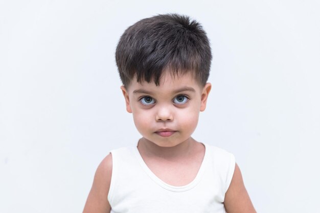 Baby boy in white tshirt over white background