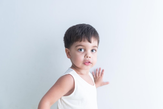 Baby boy in white tshirt over white background